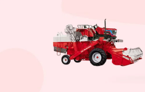 Red tractor-mounted harvester